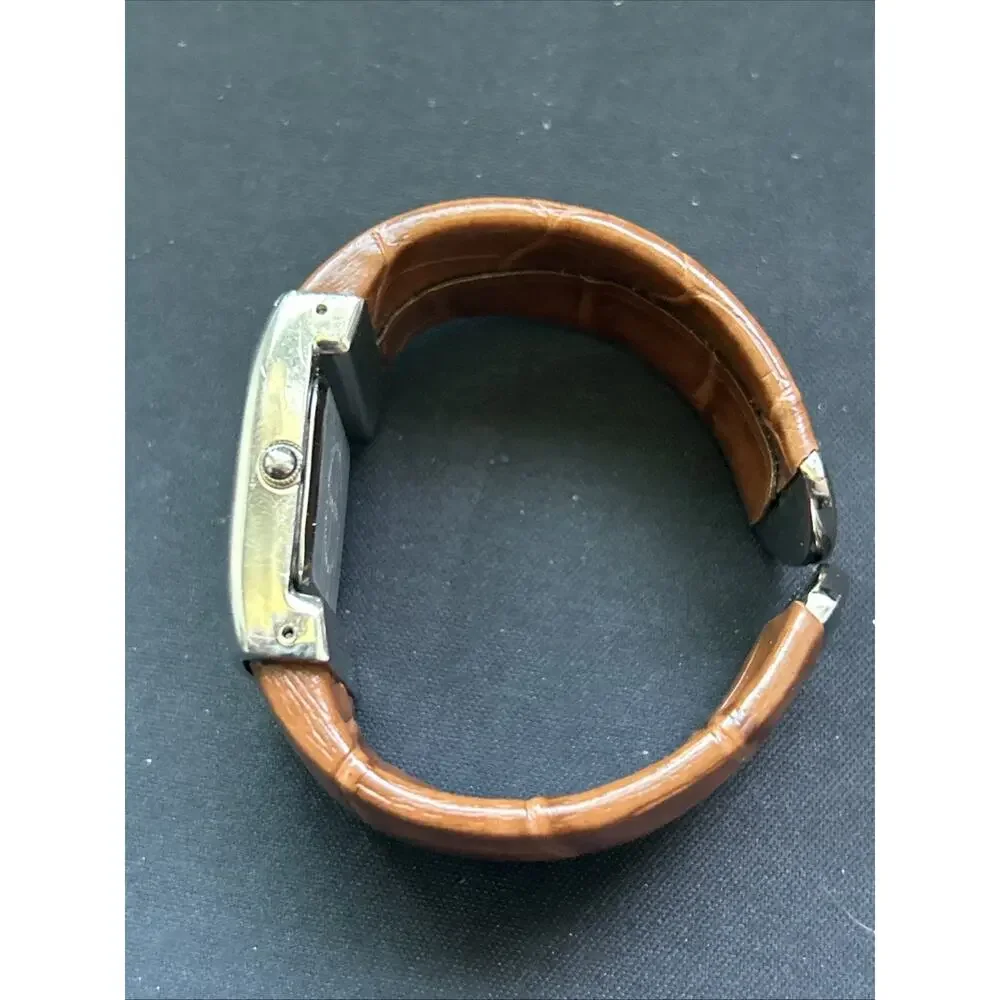 Silver Case White Dial Brown Band Women’s Cuff Watch